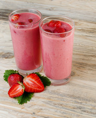 Strawberry cocktail. Fresh drinks, Smoothies. Detox drinks beautiful red strawberry on a wooden background.