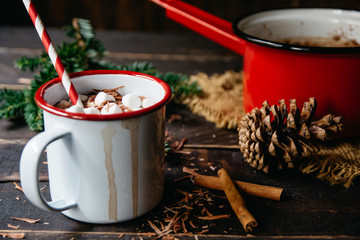Hot chocolate cup with marshmallows and a straw
