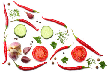mix red hot chili peppers with parsley and sliced tomato isolated on white background top view