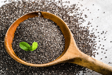 Healthy food, source omega-3 - chia seed, close-up on wooden spoon
