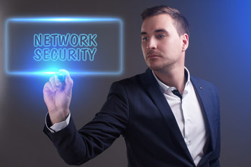 The concept of business, technology, the Internet and the network. Young businessman showing inscription: Network security