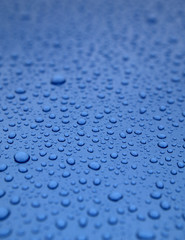 Water droplets on blue surface