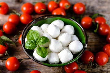 Cherry tomato, mozzarella and basil for caprese salad, italian food concept