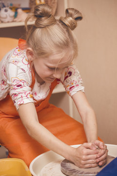 girl in a pottery workshop