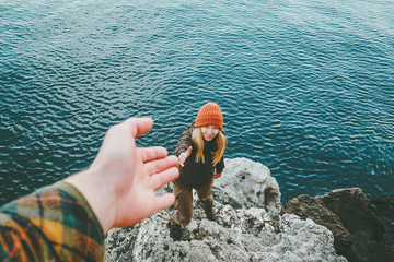 Couple Man and Woman help giving hands Love and Travel Lifestyle concept. Young family vacations at sea outdoor