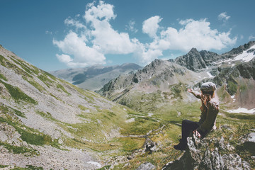 Naklejka premium Woman relaxing enjoying landscape mountains and lake Travel Lifestyle adventure concept summer vacations outdoor exploring wild nature