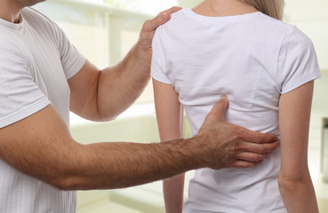 Chiropractic back adjustment. Osteopathy, Alternative medicine, pain relief concept. Physiotherapy,...