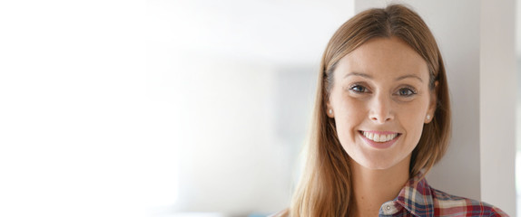 Portrait of smiling brunette girl looking at camera- template