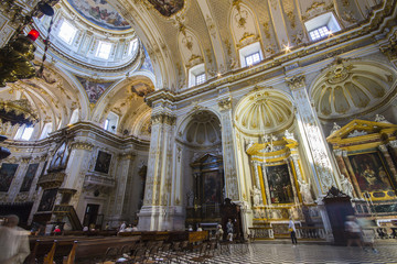 Fototapeta na wymiar Inside Bergamo Cathedral (Duomo di Bergamo, Cattedrale di Sant'Alessandro). It has a Latin cross ground plan with a single nave and a Baroque decoration