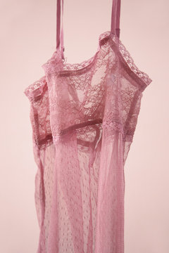 pastel pink lace underwear on pink background