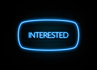 Interested  - colorful Neon Sign on brickwall