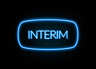 Interim  - colorful Neon Sign on brickwall