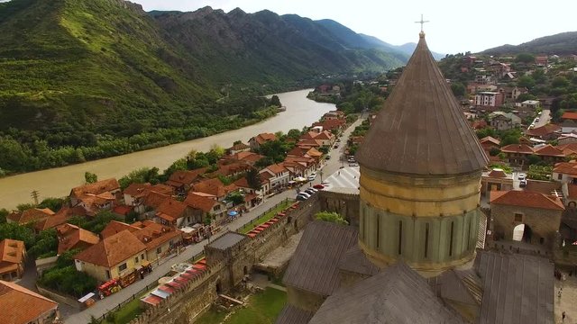 Drone video of ancient Georgian architecture, amazing rooftop view of city