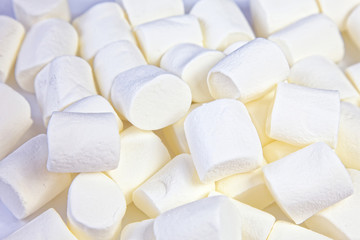 Fototapeta na wymiar Close up background of many white fluffy marshmallows