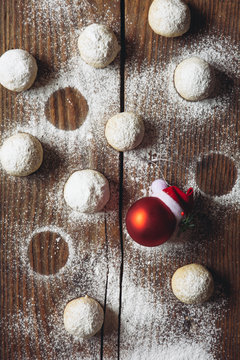 Russian tea balls on table with red Christmas bauble