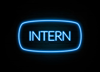 Intern  - colorful Neon Sign on brickwall