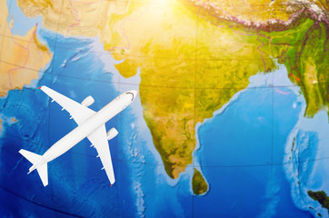 Flight to India symbolic image of travel by plane map.