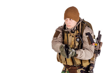 private military contractor aiming with black pistol.