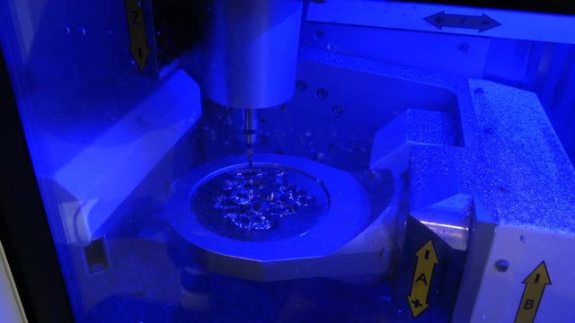 4K video footage of dry touch dental milling machine, stomatology equipment closeup process