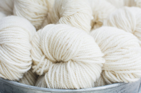 Skeins of white woolen yarn