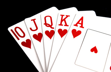 Close Up of Poker Hand Heart Royal Flush