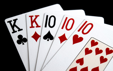 Full House Poker Hand on Black Background