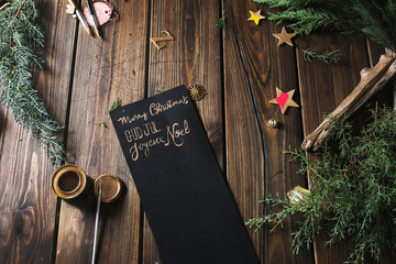 writing christmas message with gold paint