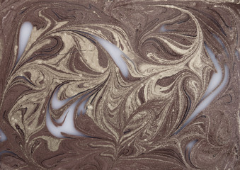 Liquid gold marbled pattern. Beige background