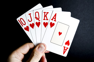 Poker Hand Hearts Royal Flush on Black Background