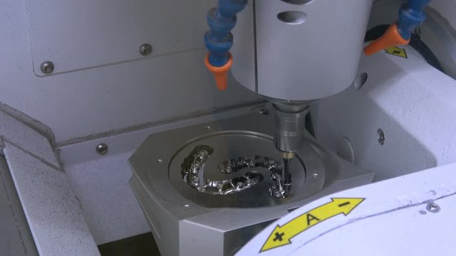 4K video footage of dry touch dental milling machine, stomatology equipment closeup process