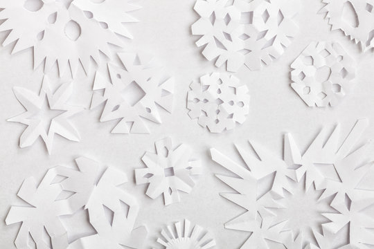 Handmade paper snowflakes made for Christmas decoration on white background