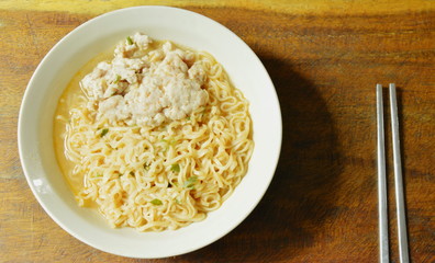 instant noodle topping minced with soup and stainless chopsticks