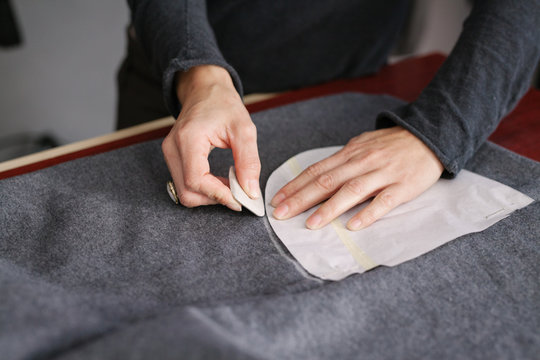 Young woman designer working in atelier