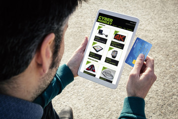 shopping on cyber monday on tablet with credit card