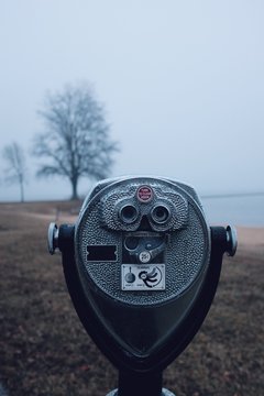 Binocular telescope camera on a foggy beach during the winter months in Maryland
