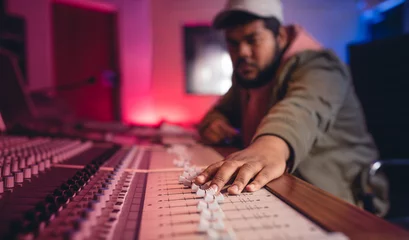 Fotobehang Sound engineer working on music mixer © Jacob Lund