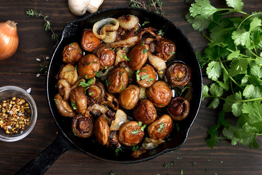 Cooked mushrooms in cast iron pan