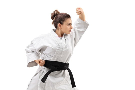 Girl wearing a kimono practicing karate
