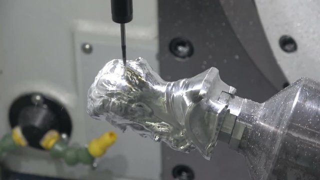 Full 5axis Spinner machine. Close up of metal processing