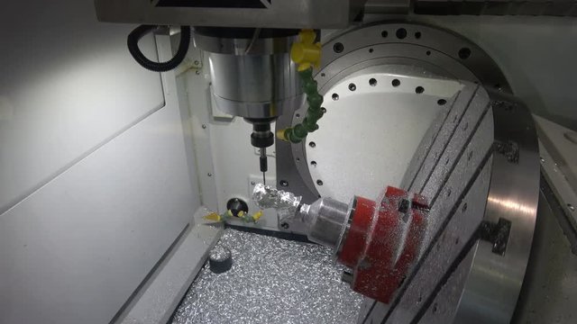 Full 5axis Spinner machine. Close up of metal processing