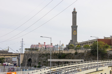 Fototapeta na wymiar The Lighthouse or Lanterna of Genoa, the main lighthouse for the citys port. At 76 m it is the worlds fifth tallest lighthouse and the second one built of masonry