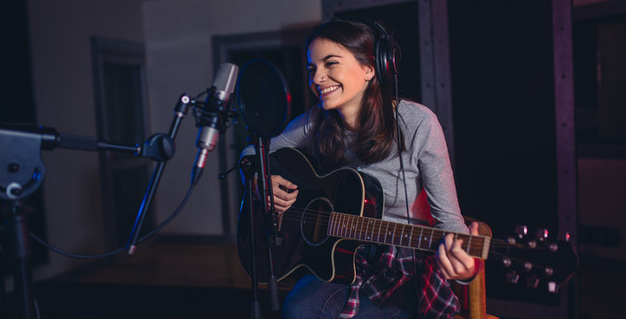 Singer recording her album in music studio