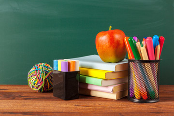 back to school - apple and books with pencils and blackboard © fotofabrika