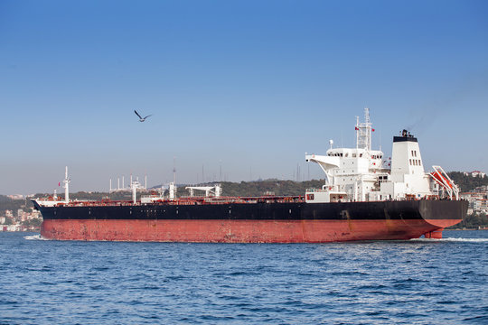 Large cargo ship tanker in the Bosphorus Strait in Istanbul, freight water transport concept