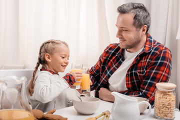 father and daughter having breakfast