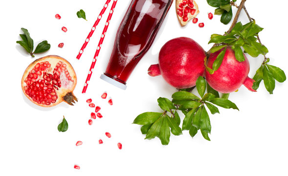 Juice and fruit of pomegranate, above view.