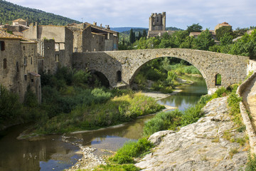 Fototapeta na wymiar Views of the Abbey of St. Mary of Lagrasse (abbaye Sainte-Marie) and the Old Bridge (Pont-Vieux), France