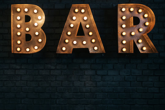 Vintage Industrial 'Bar' Sign Glowing in the Dark