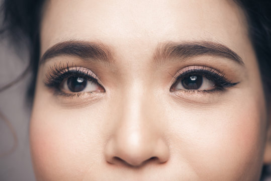 Asian model eye close-up with long eyelashes. Selective focus