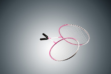 Color photo of two rackets for badminton